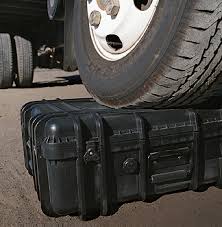 tactical case underneath a car tire